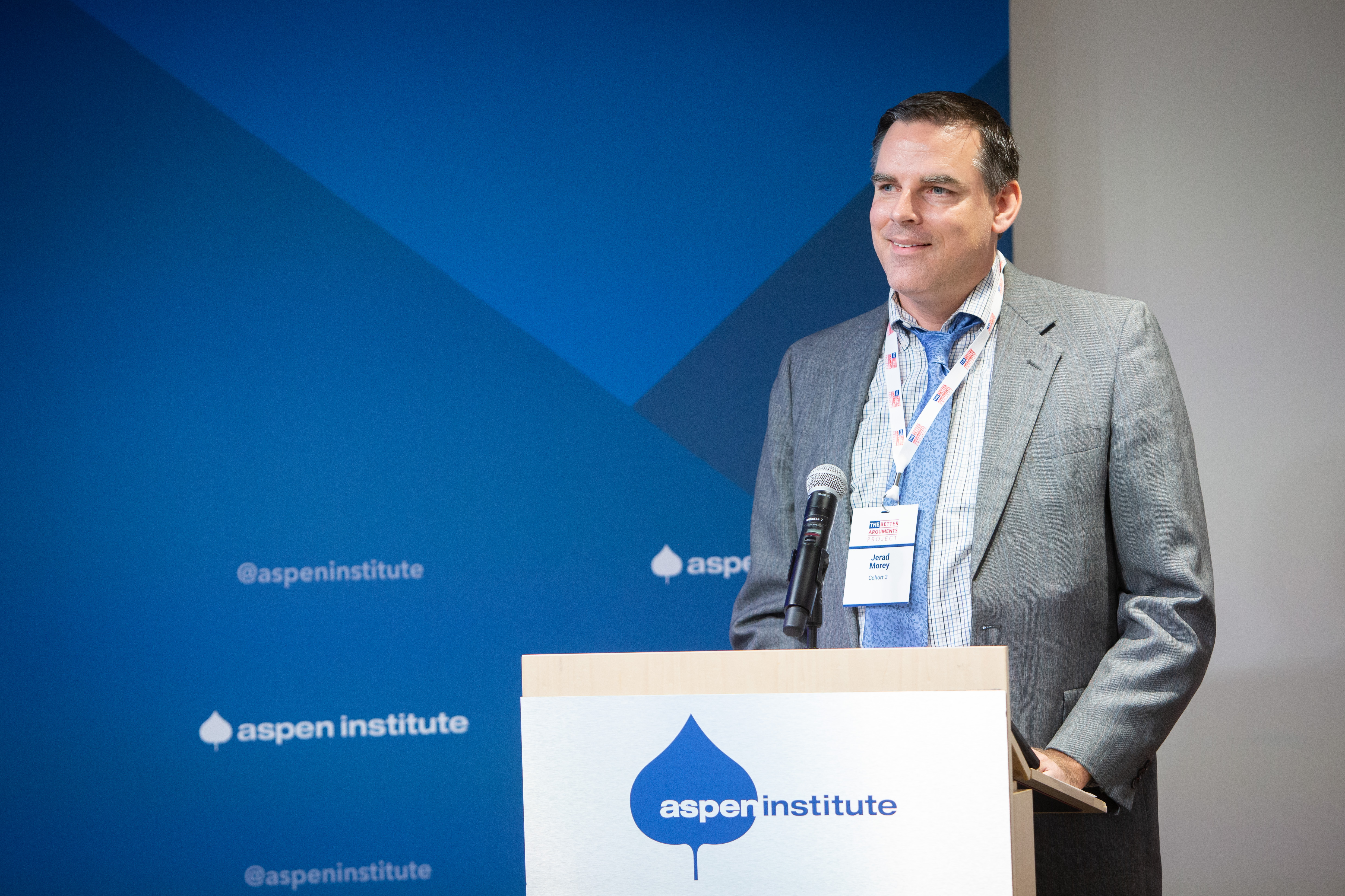 Director of Strategic Relationships Jerad Morey smiling while presenting at the Aspen Institute